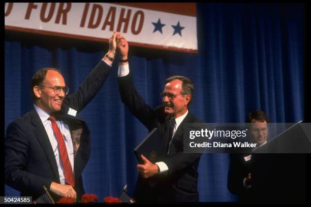 Pres. Bush & Rep. Larry Craig raising linked hands victoriously during Craig for Sen. Campaign fundraiser.