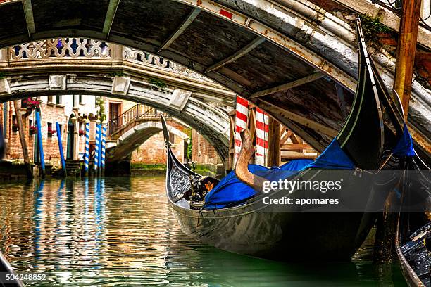 gondola in a venice canal - venice italy canal stock pictures, royalty-free photos & images