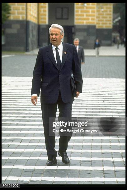 Pres. Of Russian Federation and former Politburo member Boris Yeltsin walking outside on his way to mtg. Of Supreme Soviet.