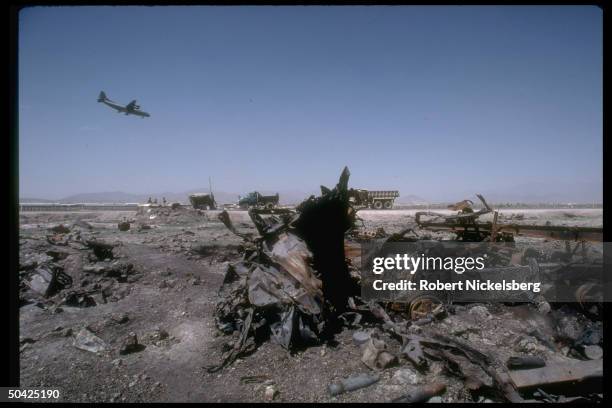 Remains of govt. Trucks bombed by mujahedin rebels.