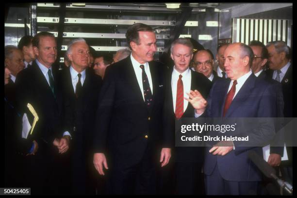 Pres. Bush w. Soviet Pres. Gorbachev during summit en- counter, w. Aides Yakovlev , Shevardnadze , Baker , & interpreter in tow.
