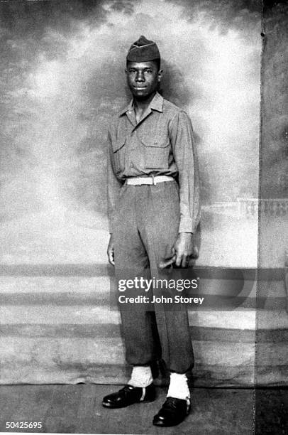 Future civil rights leader Medgar Evers posing in his army uniform in Charbourg, France.