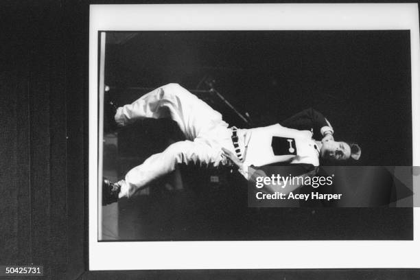 Rap singer Vanilla Ice dancing on stage as he performs at the Miami Arena.