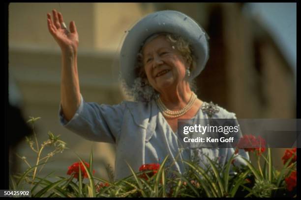 England's Queen Mother, Elizabeth, waving charmingly.