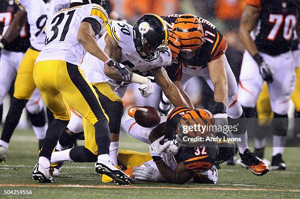 Jeremy Hill of the Cincinnati Bengals fumbles the ball in the fourth quarter against the Pittsburgh Steelers during the AFC Wild Card Playoff game at...