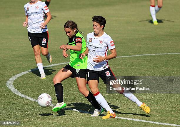 Julia De Angelis of Canberra United and Keelin Winters of the Wanderers contest possession during the round 13 W-League match between Canberra United...