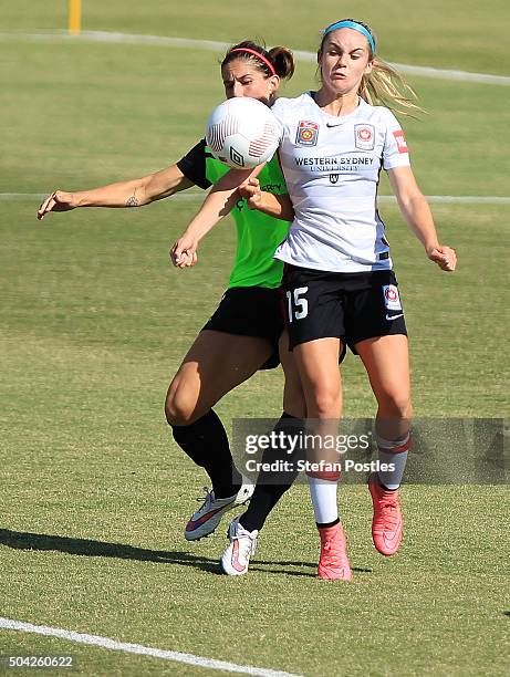 Ellie Carpenter of the Wanderers and Caitlin Munoz of Canberra United contest possession during the round 13 W-League match between Canberra United...