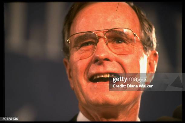 Pres. Bush having high old time, prob. At GOP fundraiser , while on road.