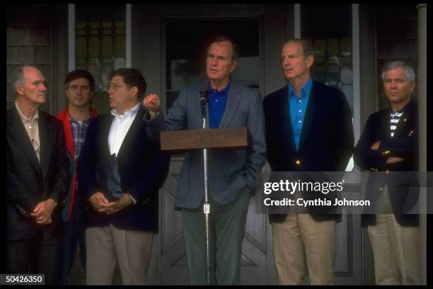 Pres. Bush w. All his men Gates, Baker, Sununu, unident. & Scowcroft, speaking outside during gulf crisis .