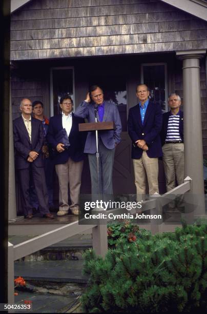 Pres. Bush w. All his men Gates, Baker, Sununu, unident. & Scowcroft, speaking outside during gulf crisis .
