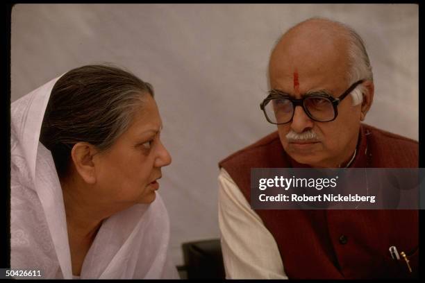 Bharatiya Janata Party ldr. L.K. Advani & member of Parliament Maharani of Gwalior Vijayaraje Scindia conferring during BJP convention.