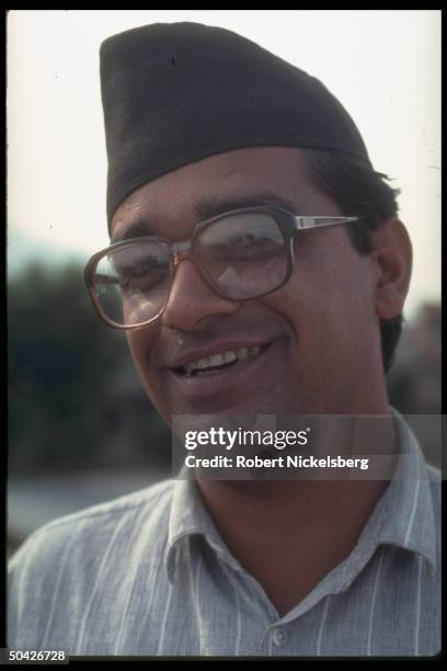 Communist Party of Nepal General Secretary Madan Bhandari smiling at CPM UML parliamentary seat gains in first free elections in 30 years.