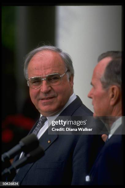 President Bush and German Chancellor Helmut Kohl making press statements in White House Rose Garden after Oval Office meeting.