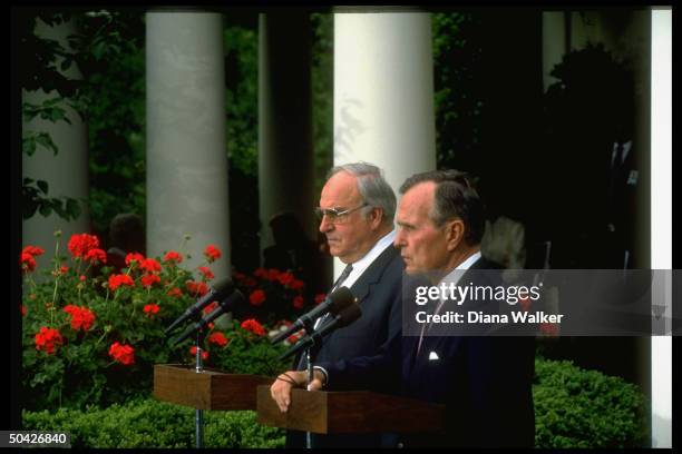 President Bush and German Chancellor Helmut Kohl making press statements in White House Rose Garden after Oval Office meeting.