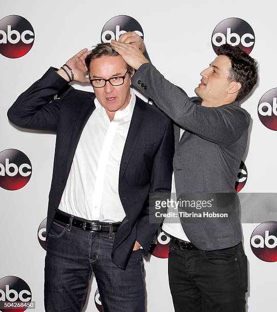 Enver Gjokaj helps Currie Graham with his hair at the Disney/ABC 2016 Winter TCA Tour at Langham Hotel on January 9, 2016 in Pasadena, California.