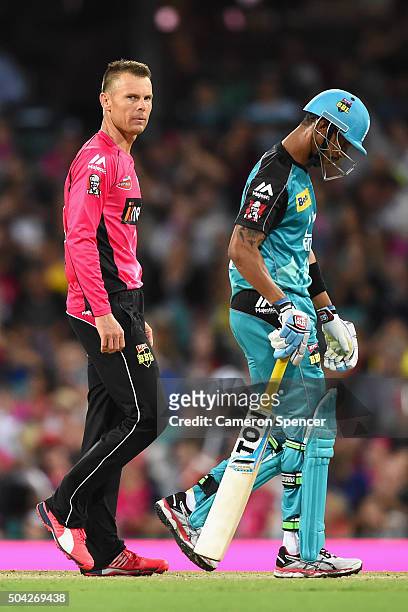 Johan Botha of the Sixers looks at Lendl Simmons of the Heat after dismissing him during the Big Bash League match between the Sydney Sixers and the...
