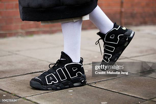 Bleu Mode photographer Julien Boudet wears Nike Air Uptempo 1996 sneakers with white socks during The London Collections Men AW16 at Vincent Square...