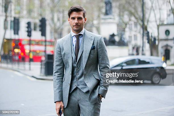 Johannes Huebl wears a Marc Anthony tailoring suit, Hackett shirt, and Brunello Cucinelli tie and pocketsquare at The London Collections Men AW16 on...