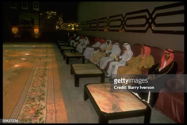 Saudi men sitting, waiting to seek Prince Salman's counsel during Riyadh Gov.'s daily majlis, in post-gulf war Riyadh, Saudi Arabia.