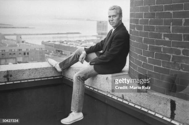 Fashion designer Michael Kors posing on the terrace of his penthouse.