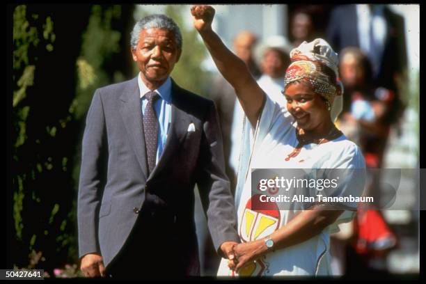 African ANC ldr. Nelson Mandela standing w. Wife Winnie.