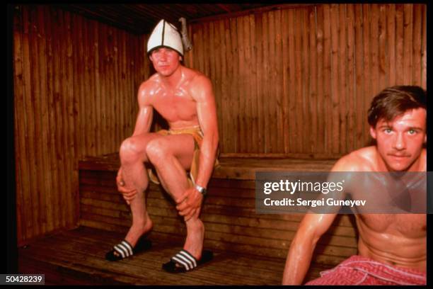 Soviet pole vaulter Sergei Bubka w. Unident. Taking pre-workout sauna.