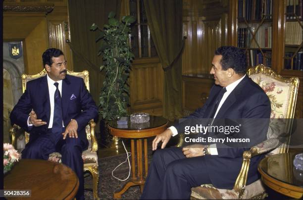 Egyptian Pres. Husni Mubarak meeting with Iraqi Pres. Saddam Hussein .