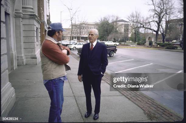 Rep. D-Ky. William H. Natcher, talking to unidentified man on the street.