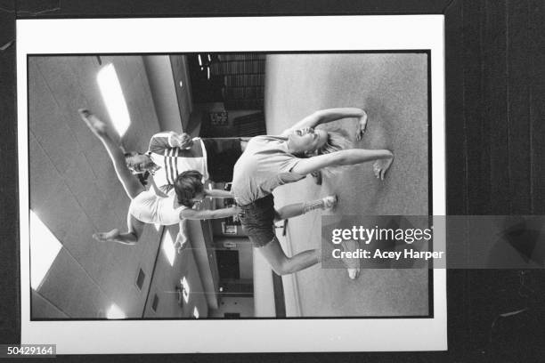 Yr-old Scarlet Eventoff performing handstand on the hips of her actress mother Victoria Jackson, who is performing a back bend, while her grandfather...