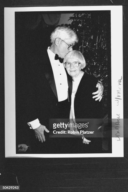 Personality Phil Donahue kissing his mother Catherine on the top of her head at celebration of the 25th anniv. Of the Donahue TV show, at the Ed...