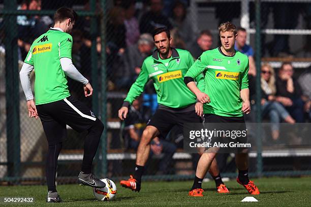 Havard Nordtveit is challenged by Martin Stranzl and Martin Hinteregger during a Borussia Moenchengladbach traning session on day 5 of the Bundesliga...