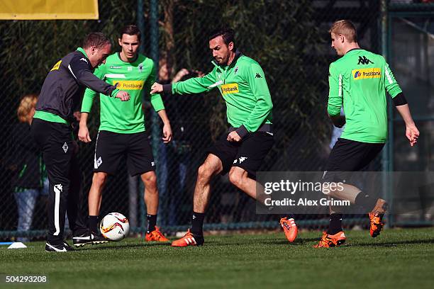 Assistant coach Frank Geideck is challenged by Martin Stranzl and Martin Hinteregger during a Borussia Moenchengladbach training session on day 5 of...