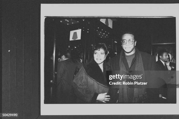 Sportscaster Ahmad Rashad w. His actress wife Phylicia arriving at theater for the screening of the movie Malcolm X.