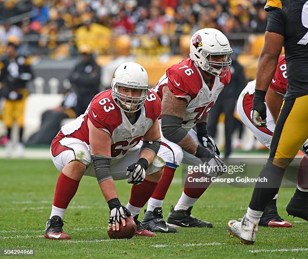 Center Lyle Sendlein and offensive guard Mike Iupati of the Arizona Cardinals look on from the line of scrimmage during a game against the Pittsburgh...