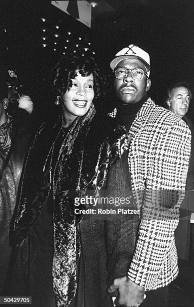 Singers Bobby Brown & Whitney Houston arriving at theater for screening of the movie Malcolm X.