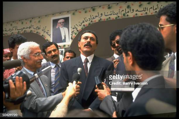 Pres. Ali Abdullah Saleh speaking to reporters after voting in parliamentary elections.