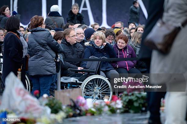 Families and victims arrive as Parisians and Politicians gather at Place de la Republique to pay tribute to the 2015 terrorist attack victims on...