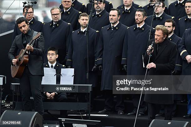 French singer Johnny Hallyday performs "Un dimanche de Janvier" with French army choir and Musician Yodelice during The Tribute To 2015 Terrorist...