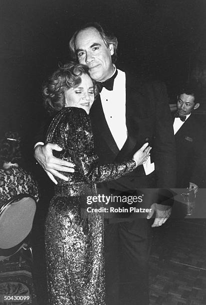 Actress Madeline Kahn hugging co-star Robert Klein at a party after she won the Tony Award for Best Actress for her performance in the Broadway play...