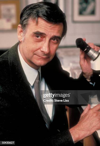 Sociobiologist Edward O. Wilson w. Microscope.