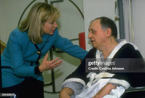 1st Lady Hillary Rodham Clinton chatting up patient in physical therapy unit of St. Agnes Medical Ctr., re her heading Pres's health care reform task...