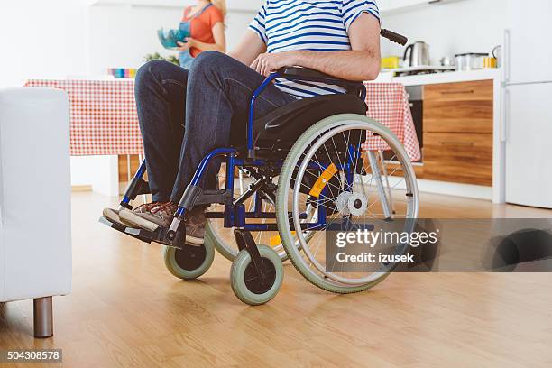 disabled man sitting in a wheelchair, close up of legs - förlamning bildbanksfoton och bilder