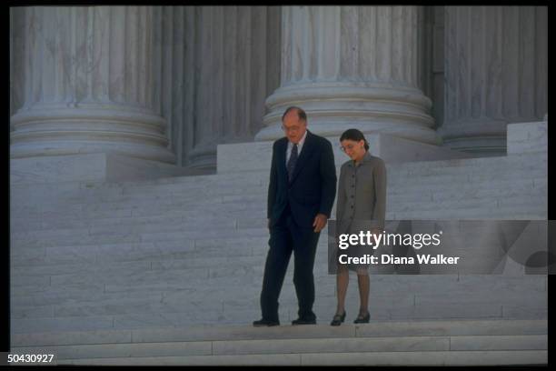 Supreme Court Chief Justice William Rehnquist escorting Ruth Bader Ginsburg down steps of Supreme Court bldg. After newest associate justice took her...