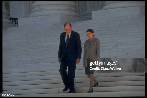 Supreme Court Chief Justice William Rehnquist escorting Ruth Bader Ginsburg down steps of Supreme Court bldg. After newest associate justice took her...