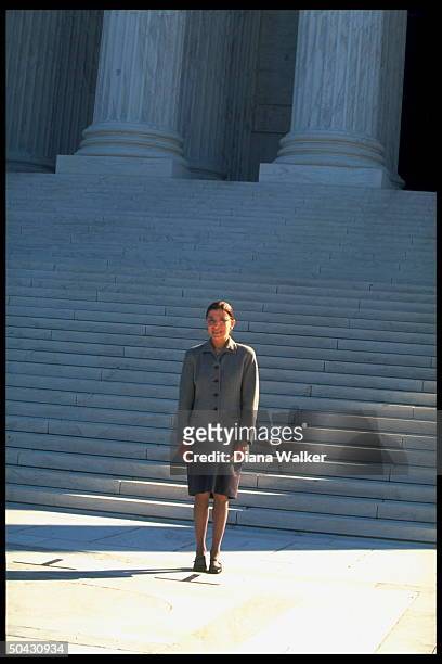 Supreme Court Justice Ruth Bader Ginsburg standing at bottom of Supreme Court bldg. Steps after newest associate justice took her oath.