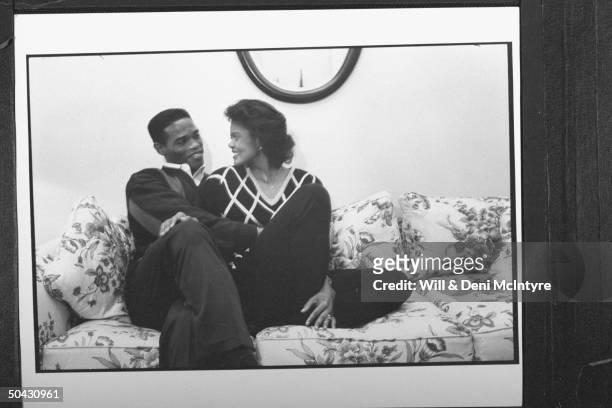Bernadette Locke-Mattox, asst. Basketball coach at Univ. Of KY, cuddling happily on couch w. Her husband Vince Mattox, a consultant to the Kentuck...