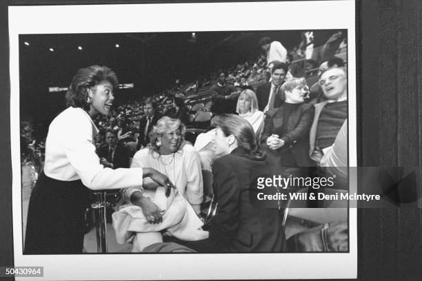 Bernadette Locke-Mattox , asst. Basketball coach at Univ. Of KY, chatting w. Joanne Pitino , wife of head coach Rick Pitino & an unident. Woman who...