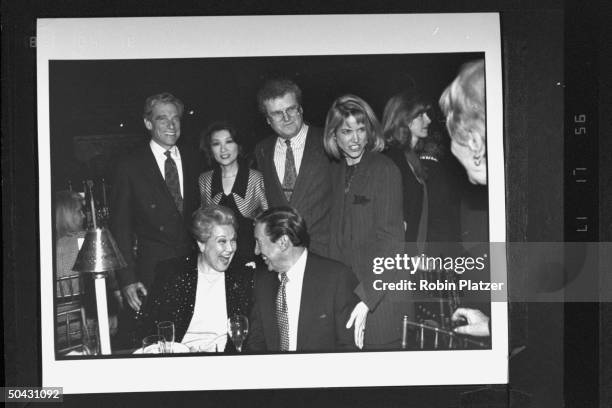 Newsman Mike Wallace chatting w. Opera singer Marilyn Horne at table in front of talk show host Maury Povich, his wife Connie Chung, CBS Broadcast...