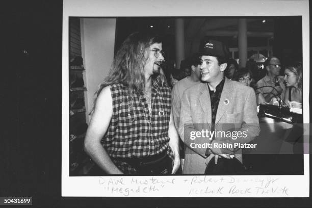 Actor Robert Downey Jr. Chatting w. Dave Mustaine fr. The rock group Megadeth at the Reebok party for Dem. Supporters during the wk. Of the Dem....