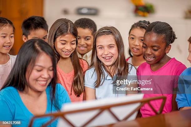 singing songs together in church - expressive and music stock pictures, royalty-free photos & images